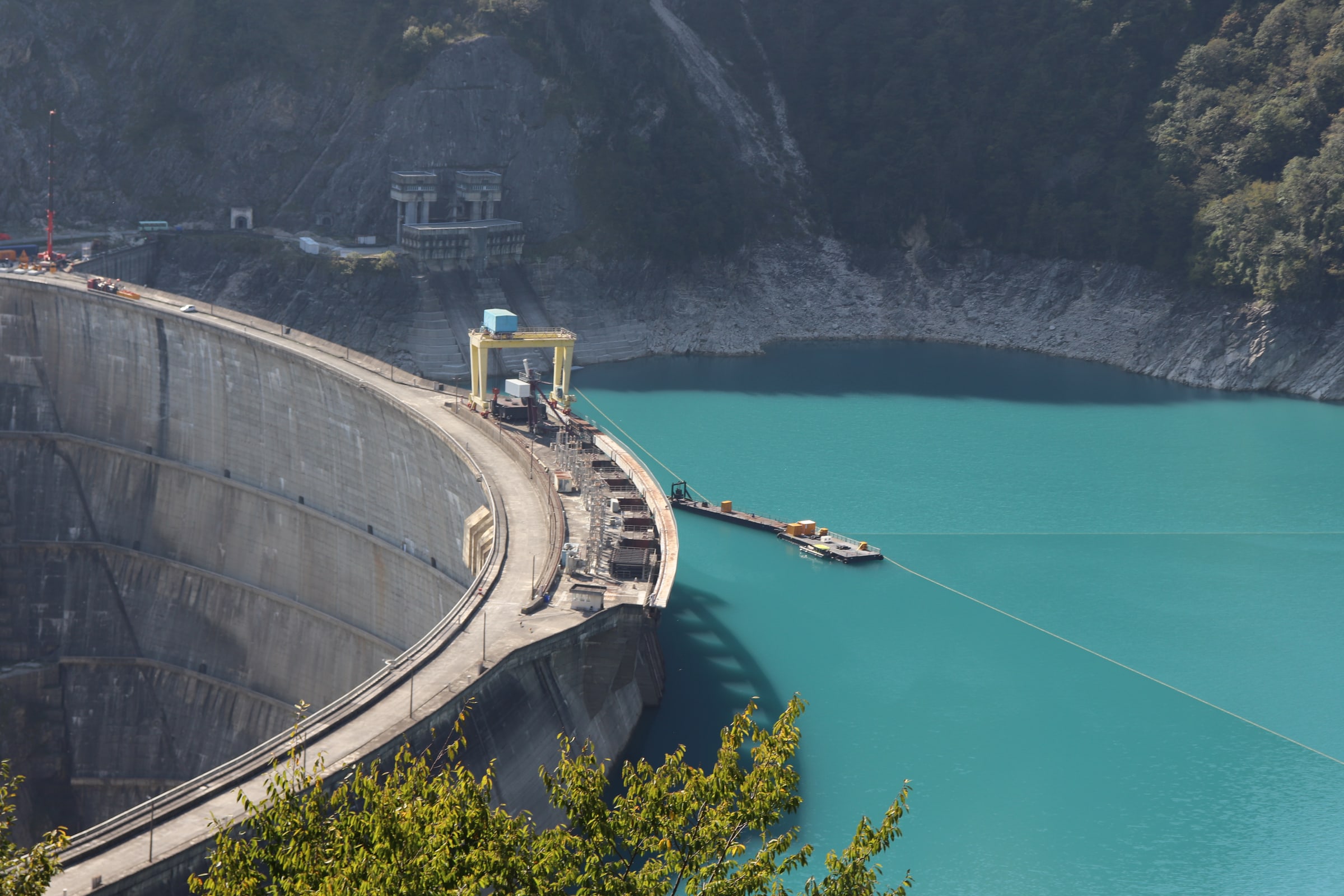 Installation work on a deep-water dredger is under way at the arch dam